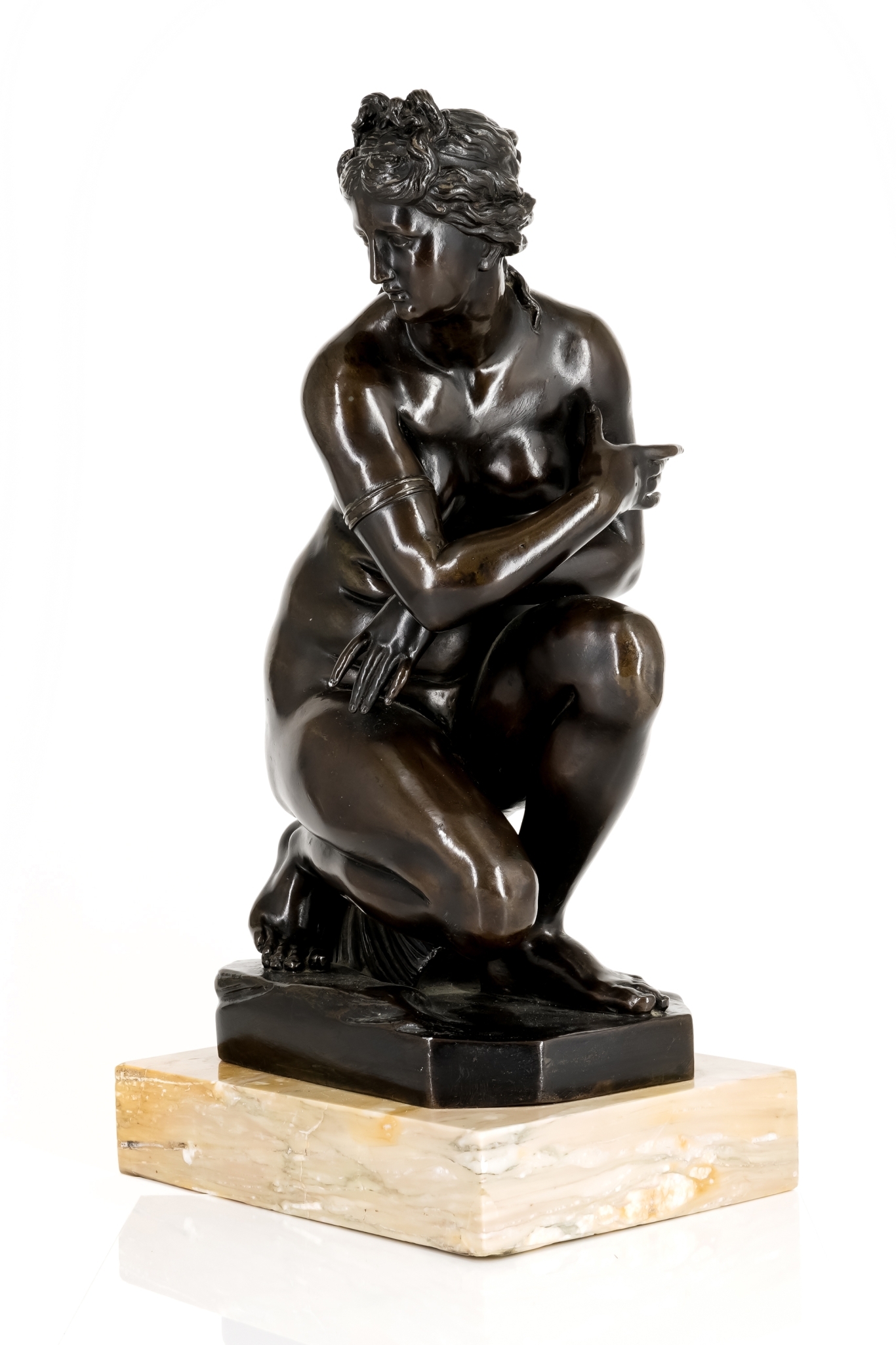 AFTER THE ANTIQUE: A BRONZE MODEL OF THE CROUCHING VENUS POSSIBLY FRENCH/ITALIAN, 18TH CENTURY  The bronze 30cm high (excluding pl £5000-8000